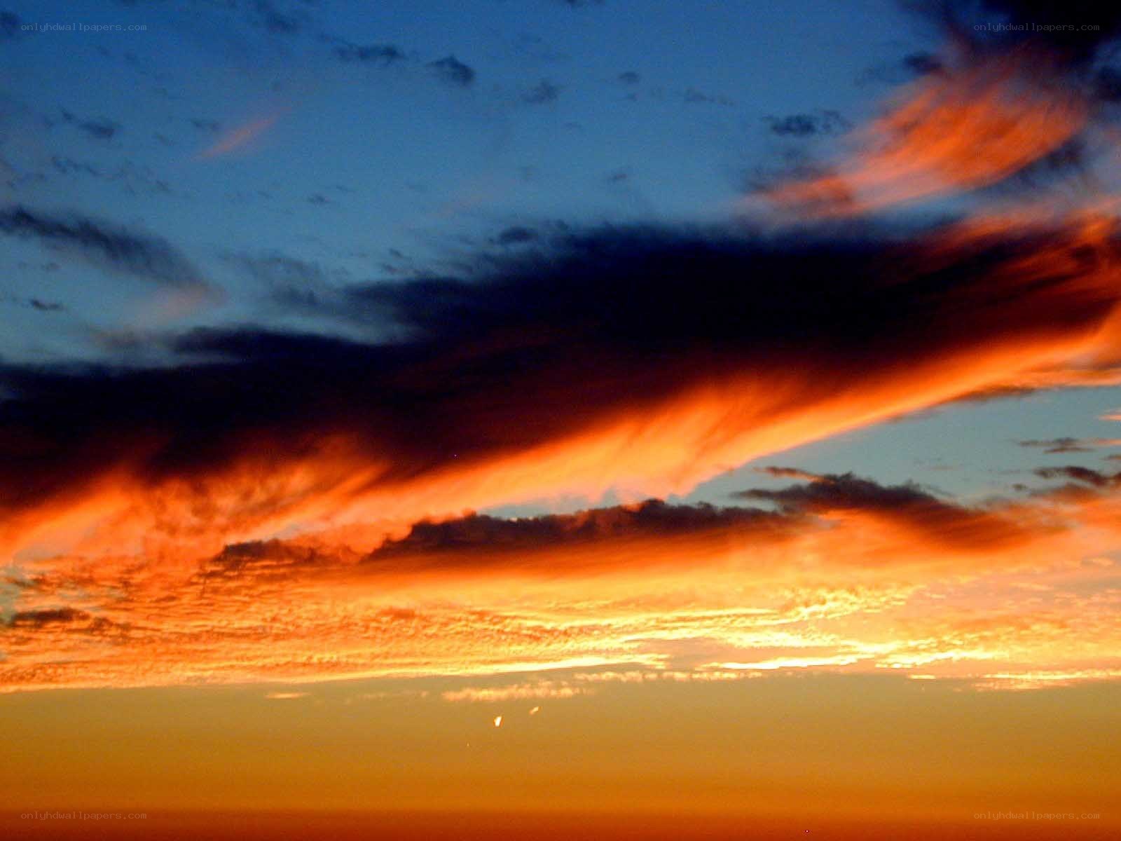 Dramatic sunset with fiery clouds
