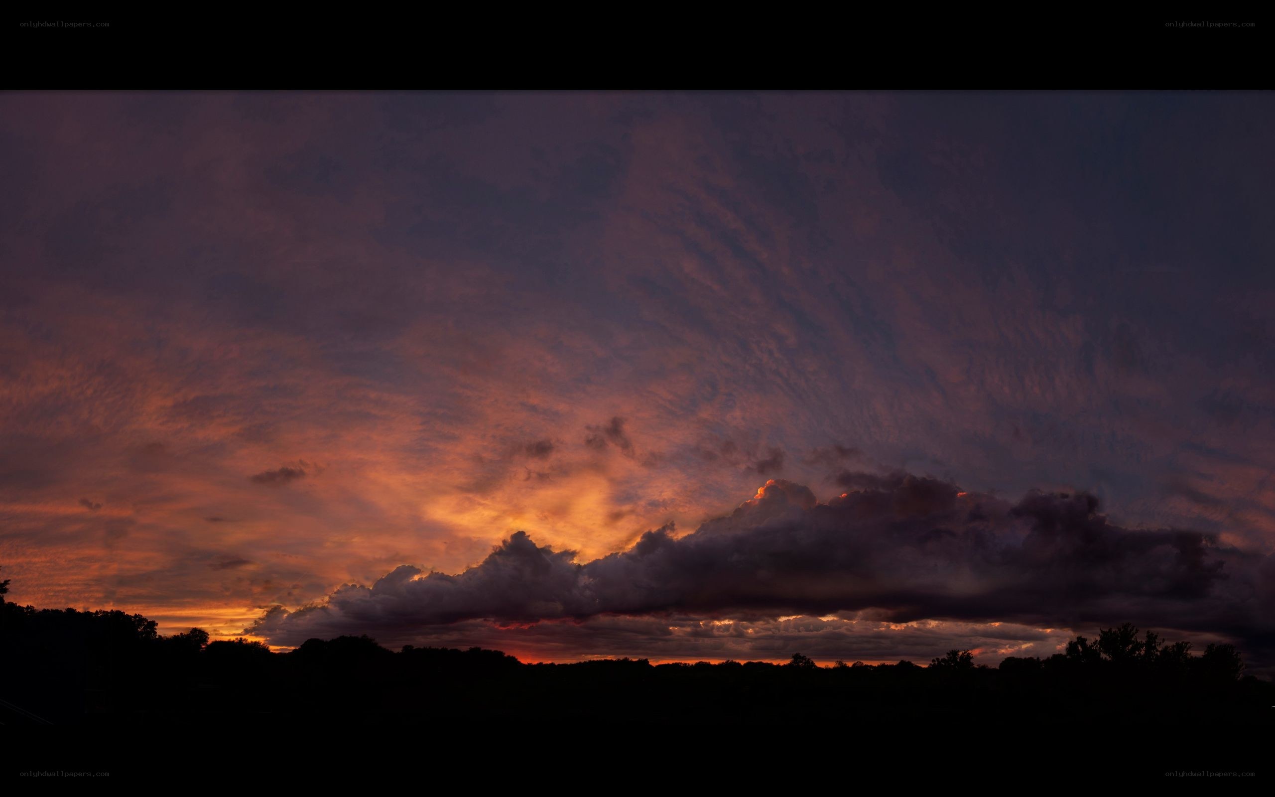dramatic sunset with fiery clouds