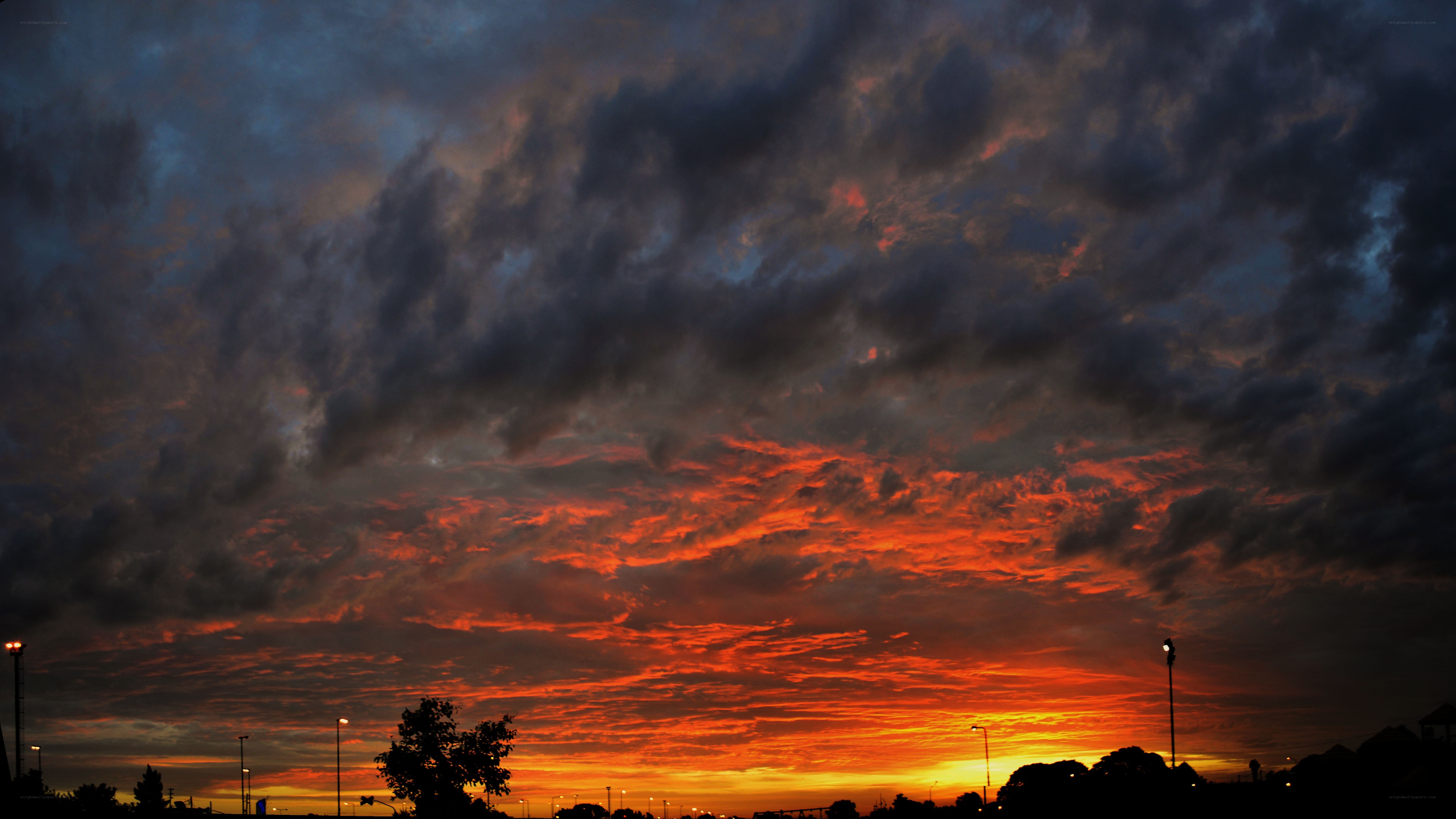 dramatic sunset with fiery clouds