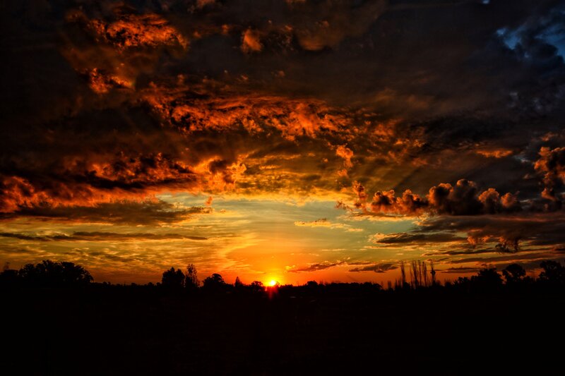 dramatic sunset with fiery clouds