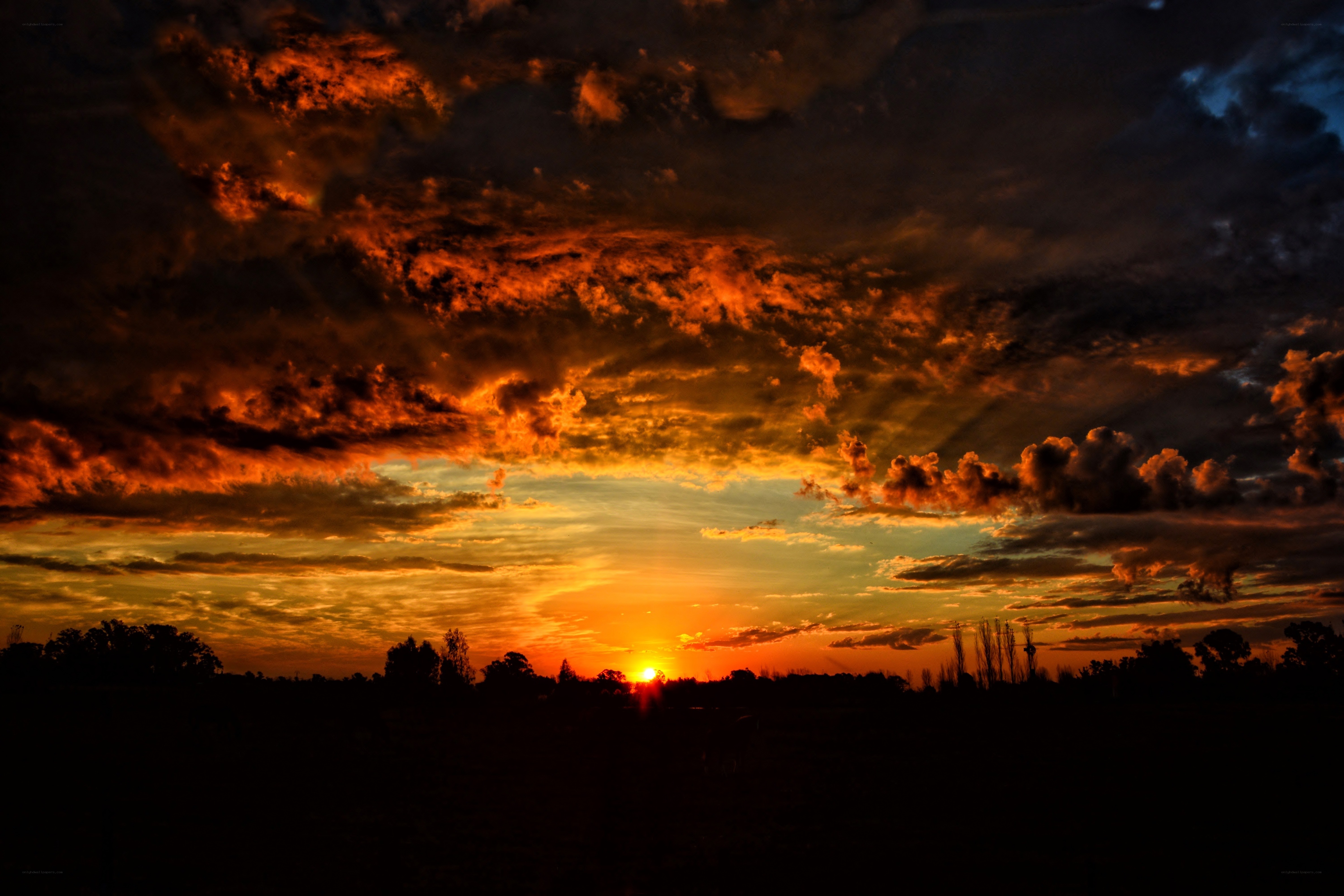 dramatic sunset with fiery clouds