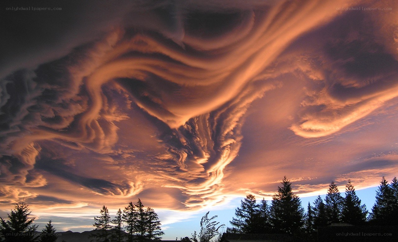 dramatic sunset with lenticular clouds