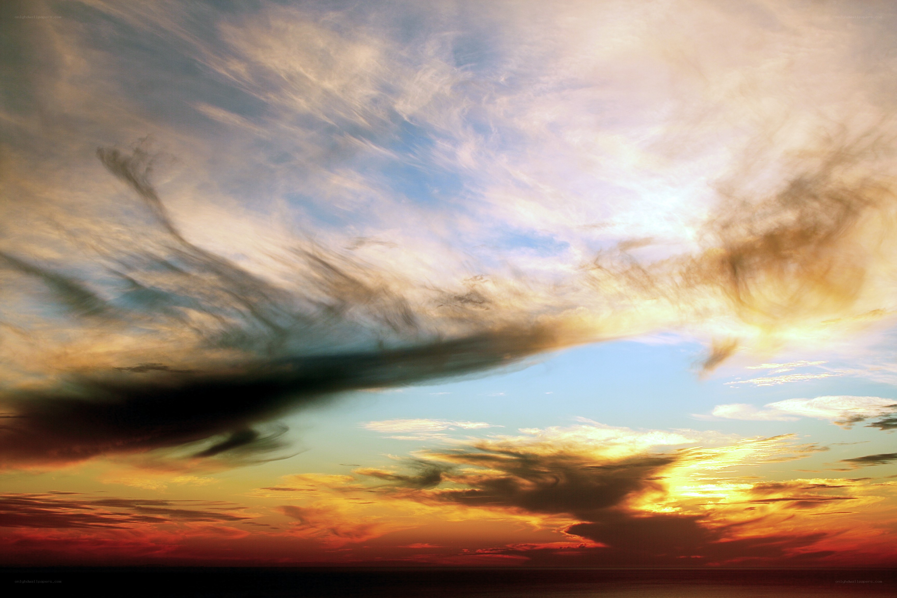 Dramatic sunset with swirling clouds