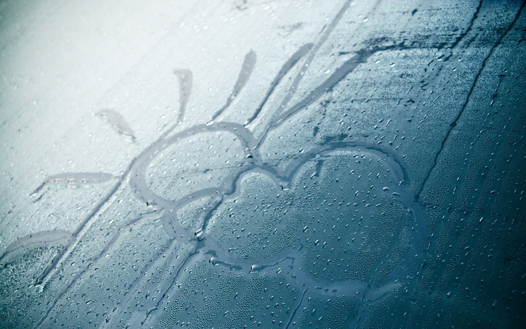 drawing on a foggy window