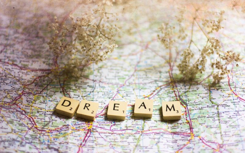 Dream word on map with flowers