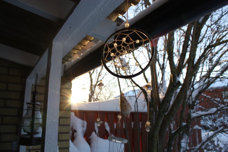 Dreamcatcher in winter sunlight