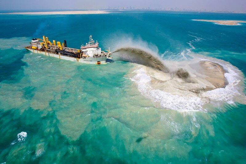 Dredging ship creating artificial island
