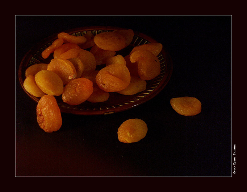 dried apricots on dark surface