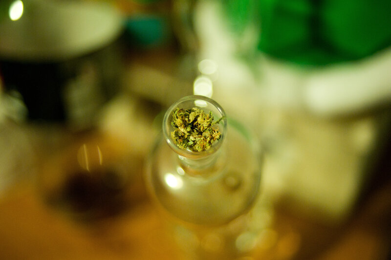 dried cannabis in a glass bottle