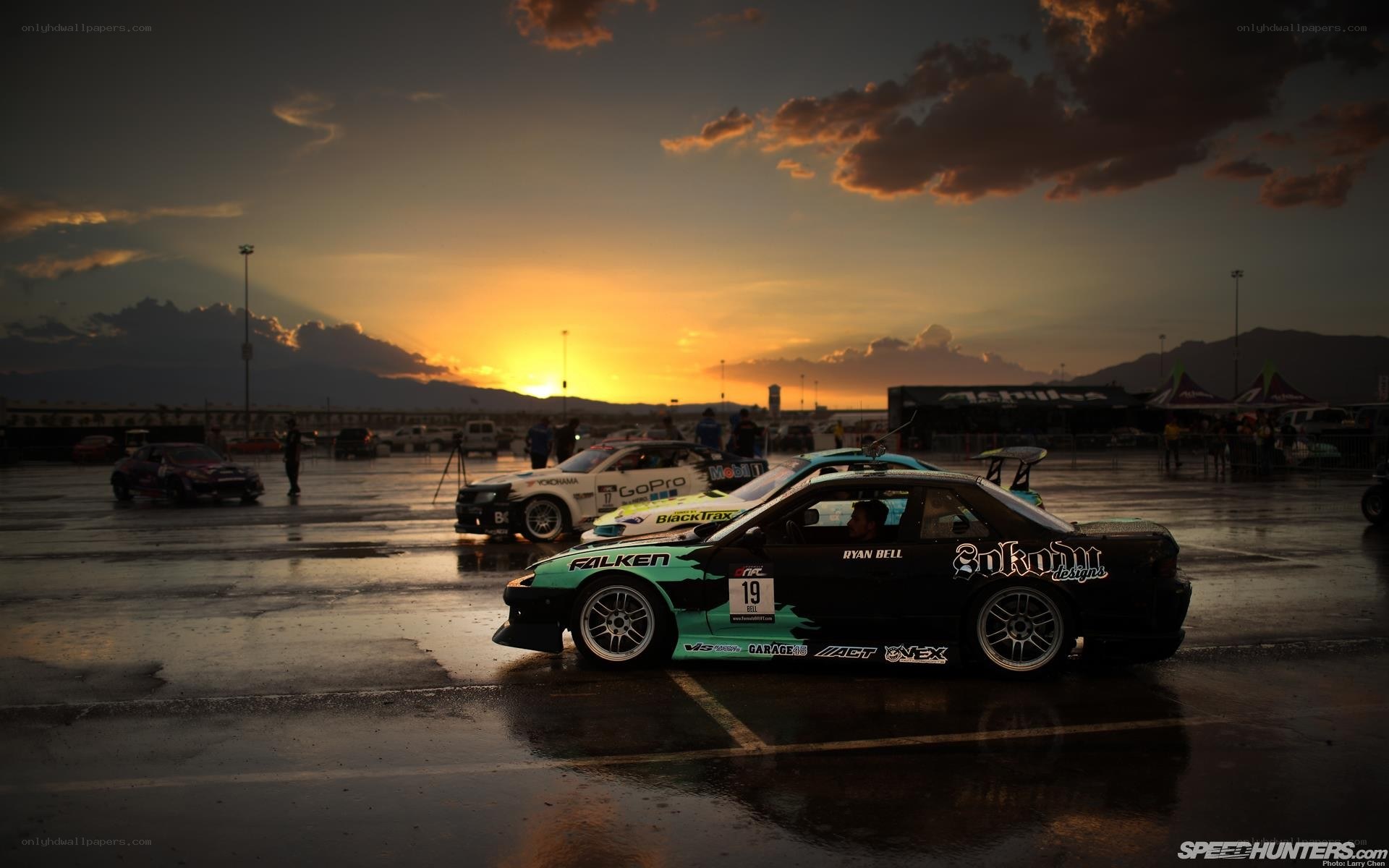 Drift cars at sunset