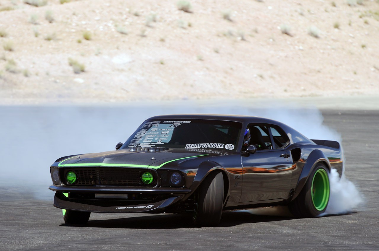 Drifting black muscle car