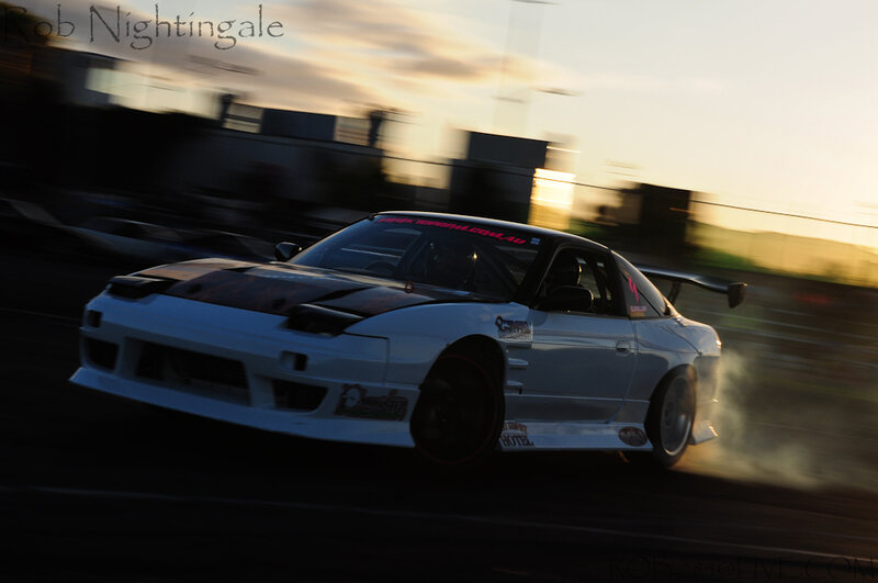drifting car at sunset