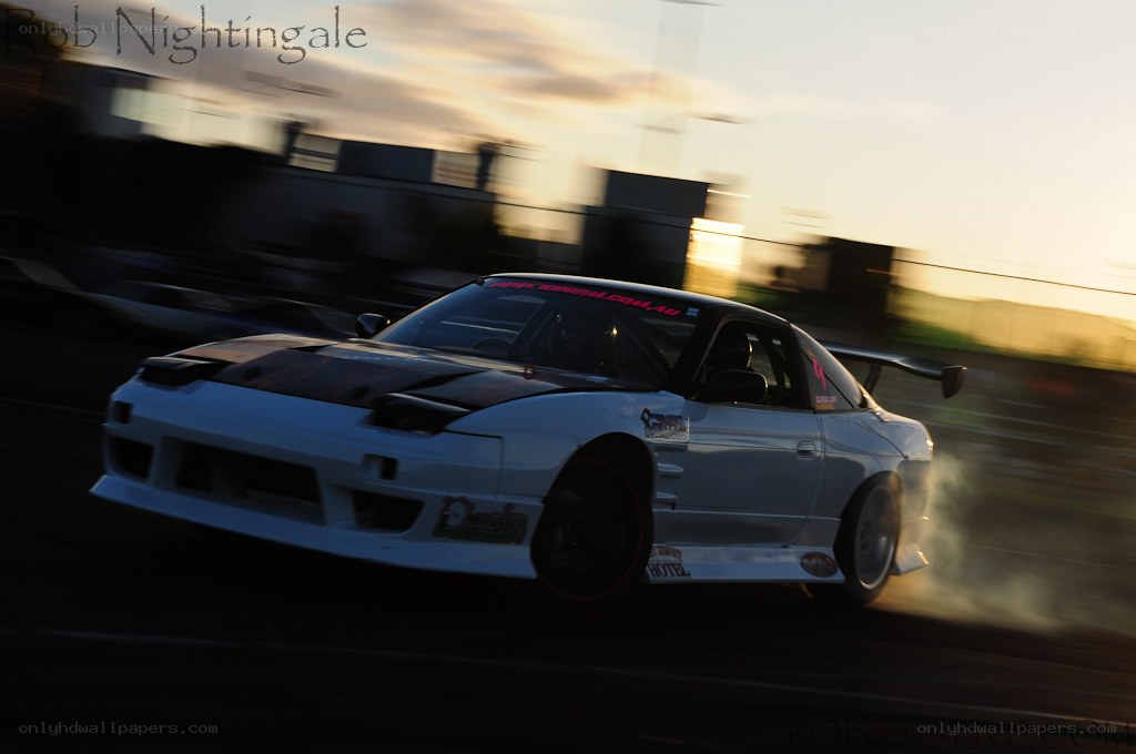drifting car at sunset