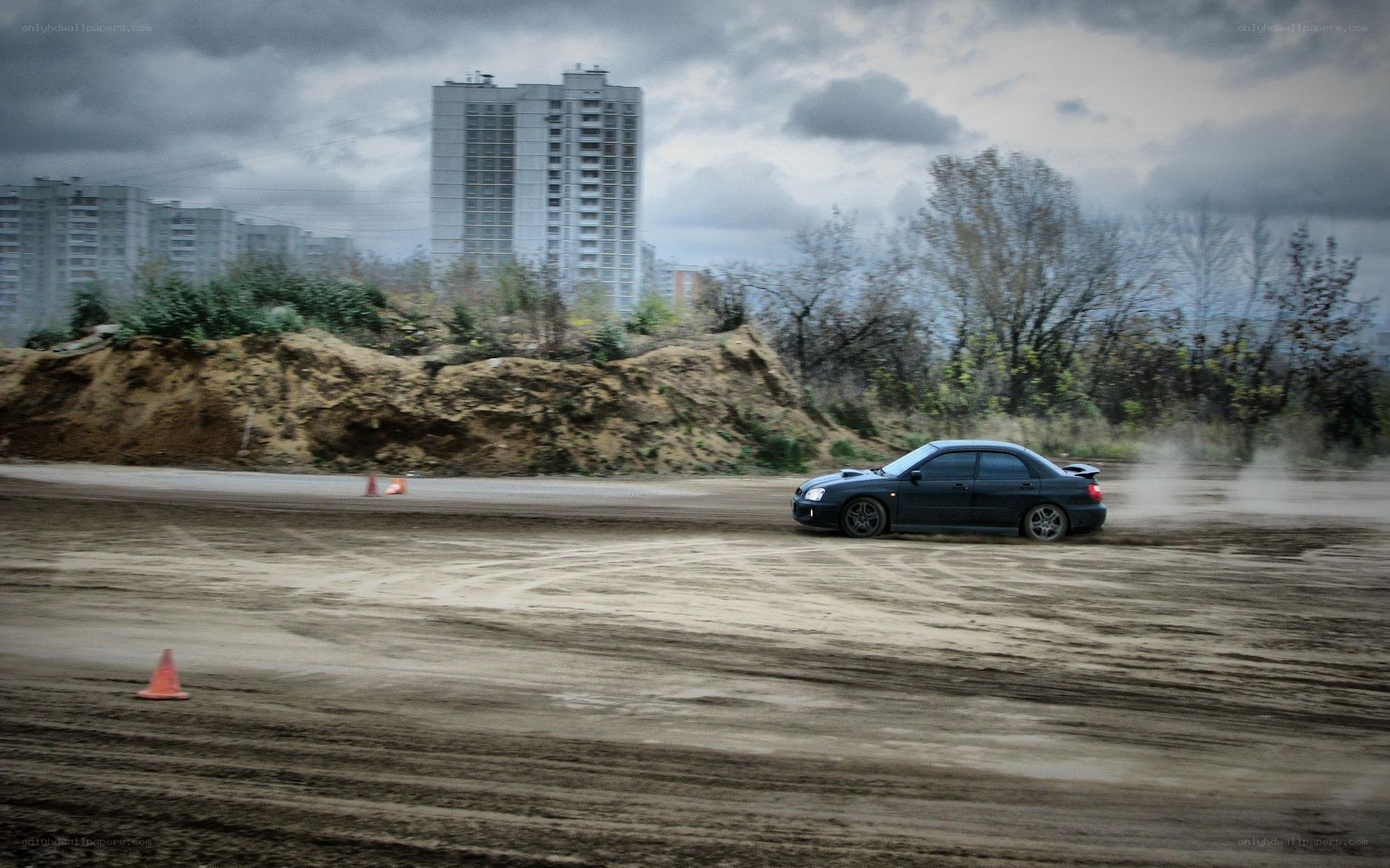 Drifting car on dirt track
