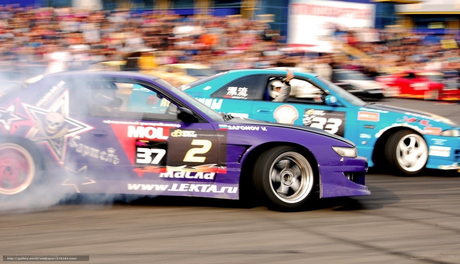 Drifting cars at a race