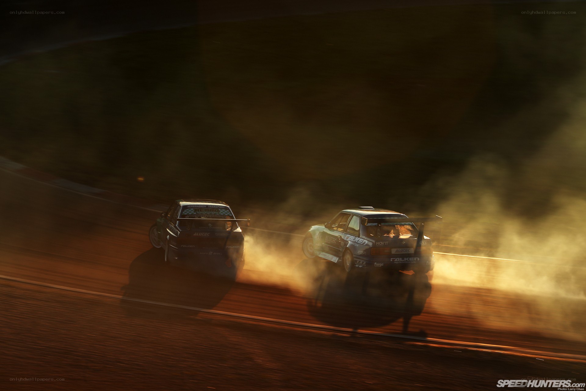 Drifting cars at sunset