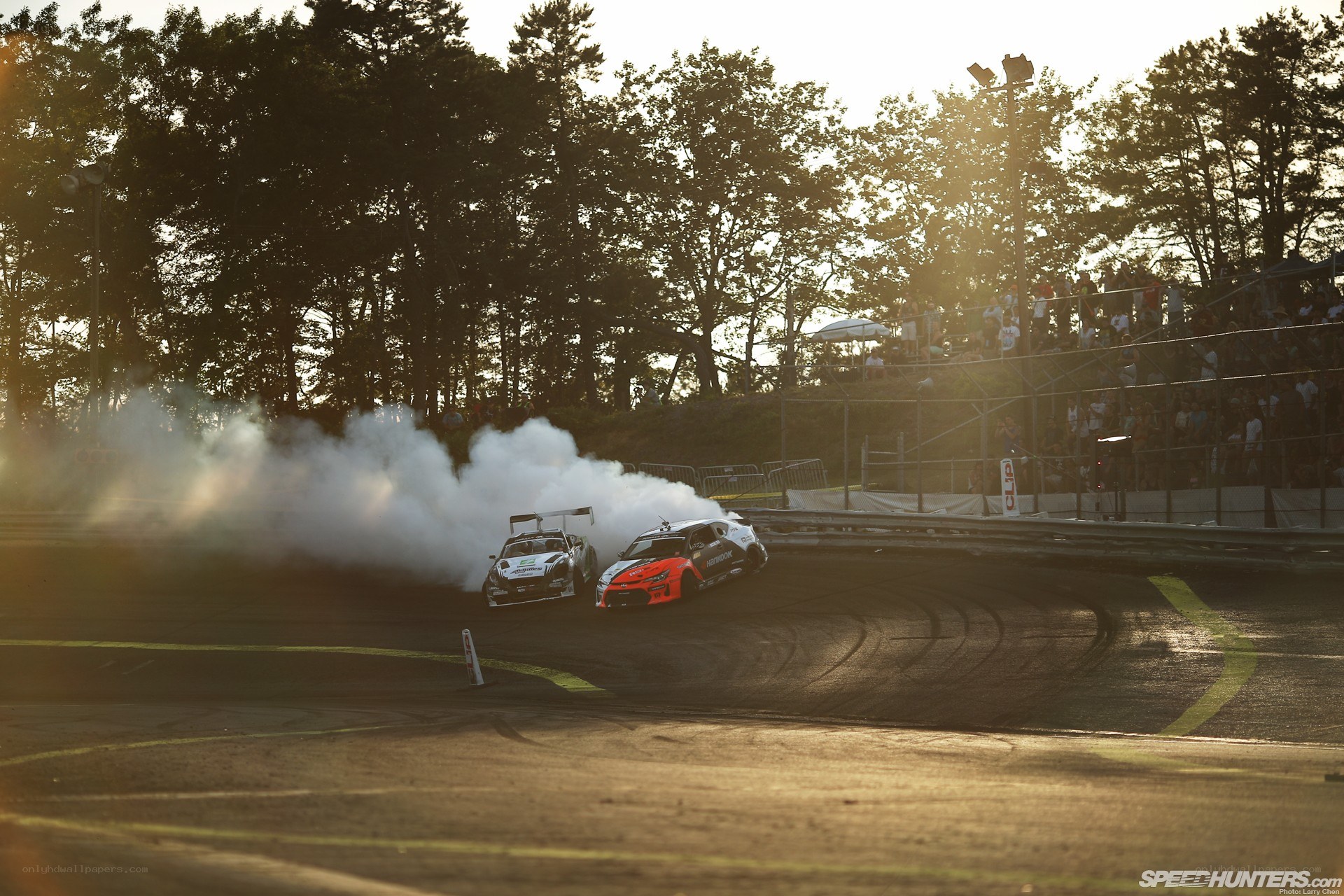 Drifting cars at sunset