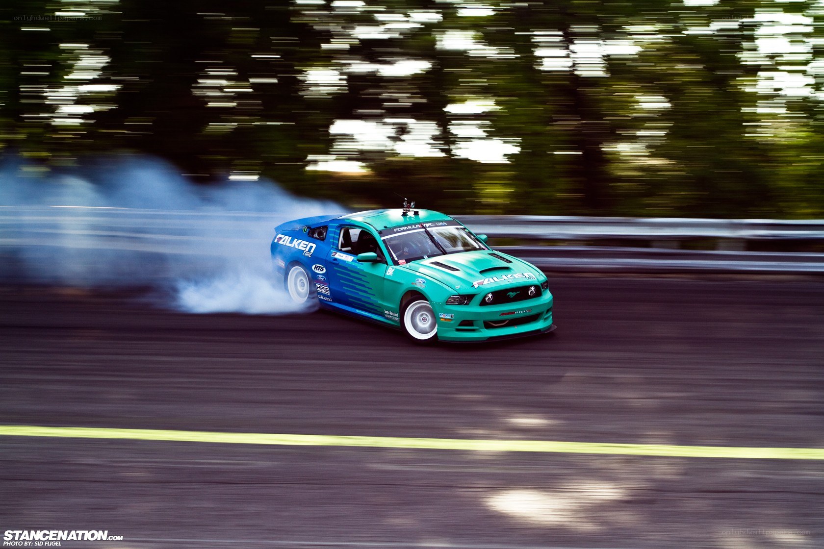 drifting green and blue car