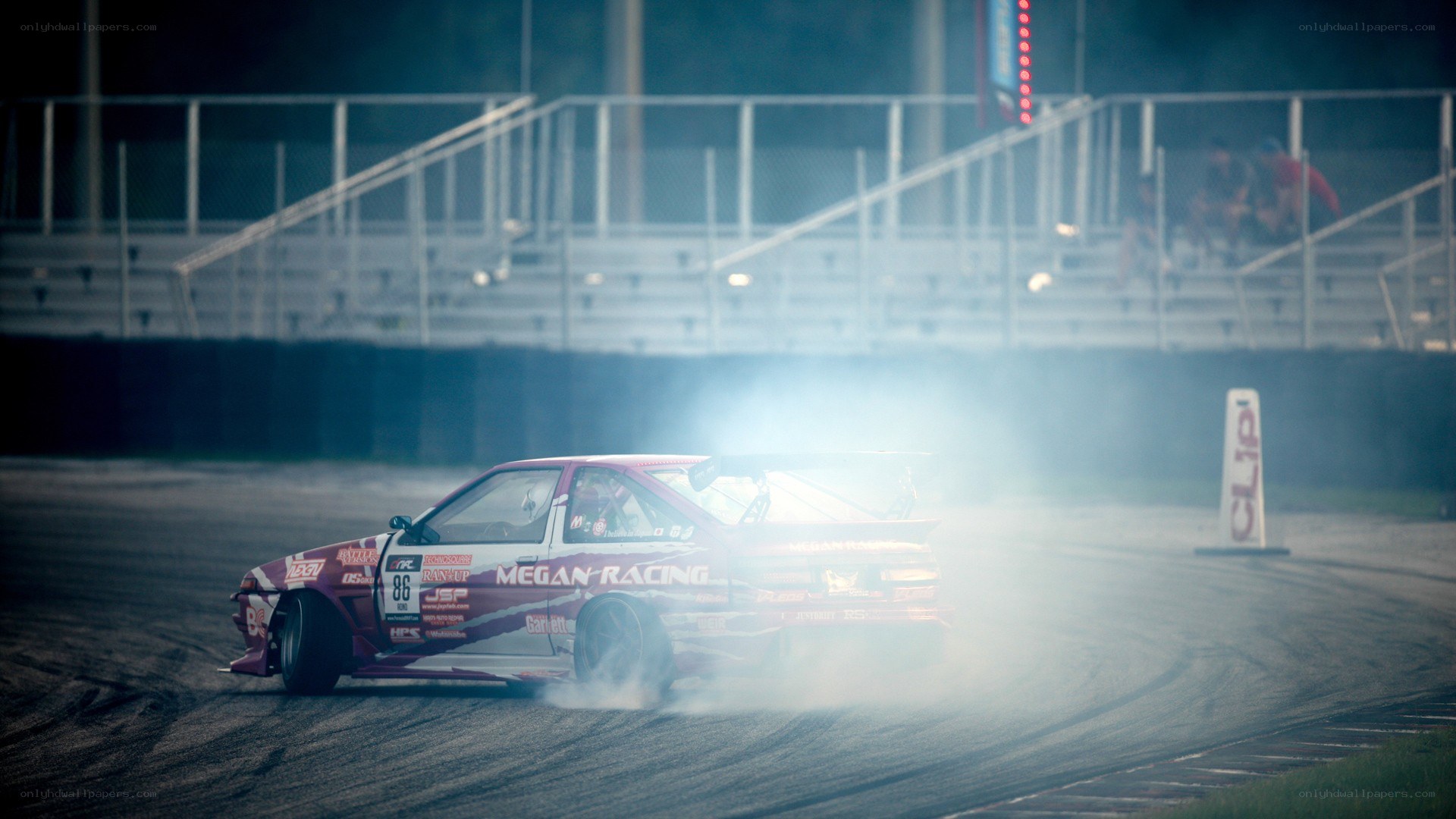 Drifting race car at night