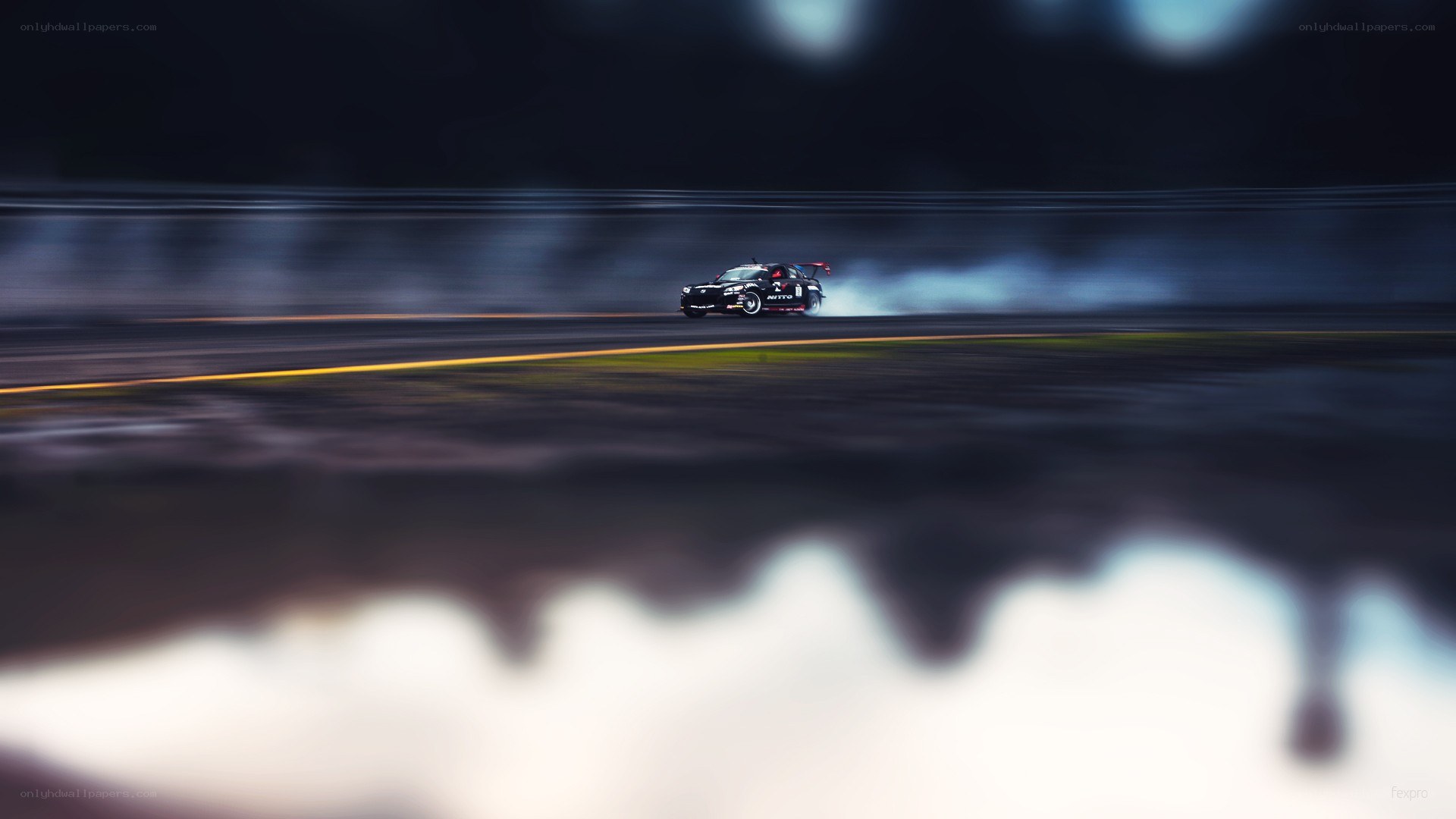 Drifting race car at night
