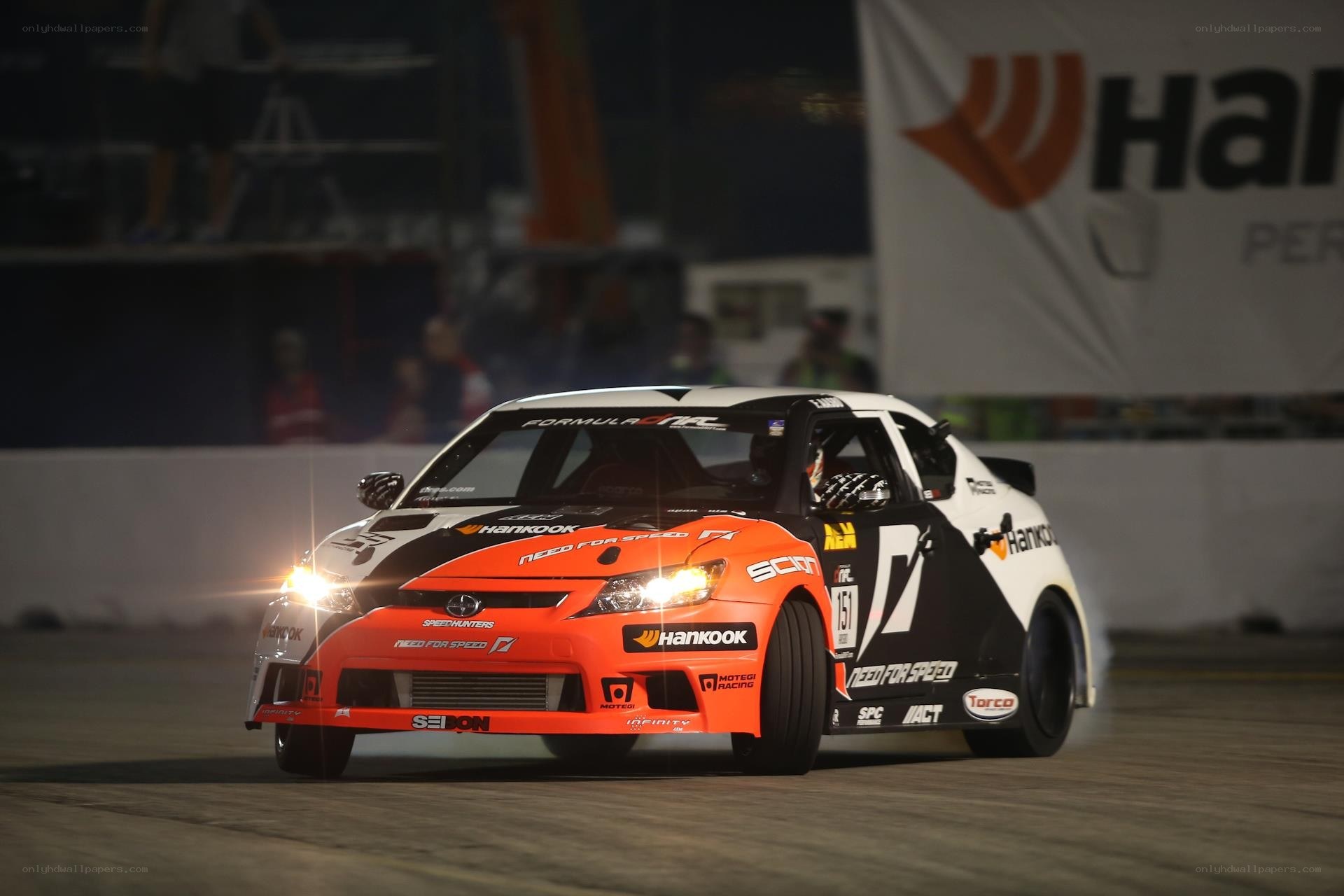 drifting race car at night