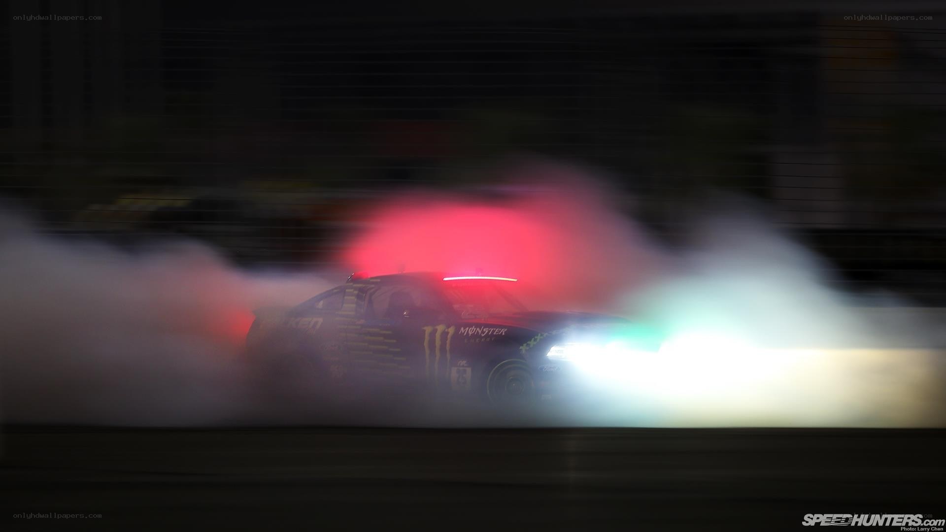 Drifting race car at night