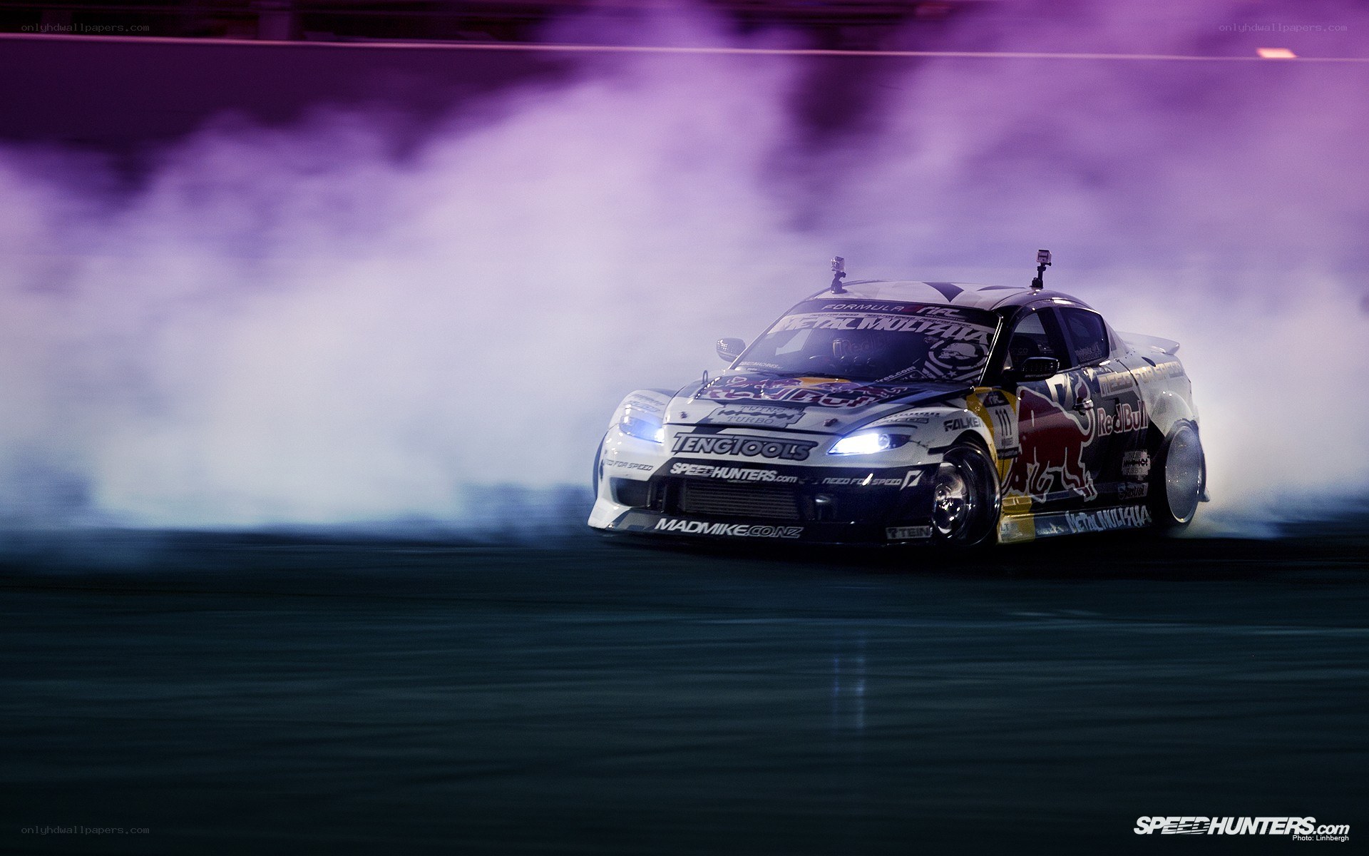 Drifting race car at night