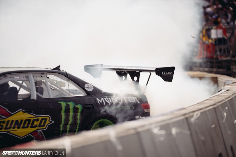 Drifting Race Car — Black, Dynamic, Afternoon, Photograph, Smoke, Crowd, Tire Marks