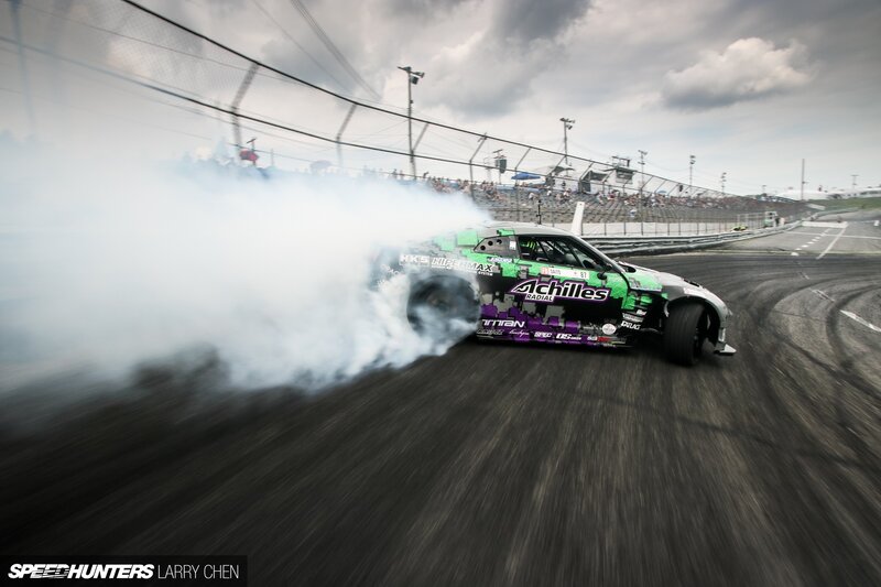 Drifting Race Car — Black, Dynamic, Afternoon, Photograph, Smoke, Racetrack, Crowd