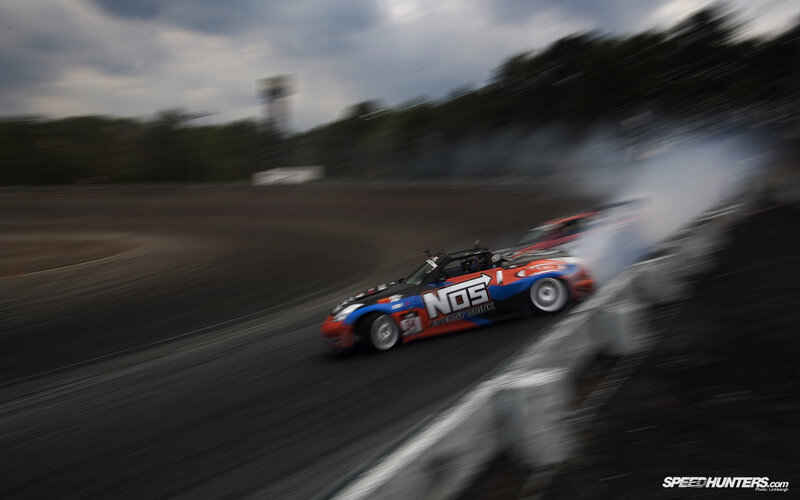 Drifting Race Car — Black, Dynamic, Afternoon, Photograph, Smoke, Racetrack, Driver, Red