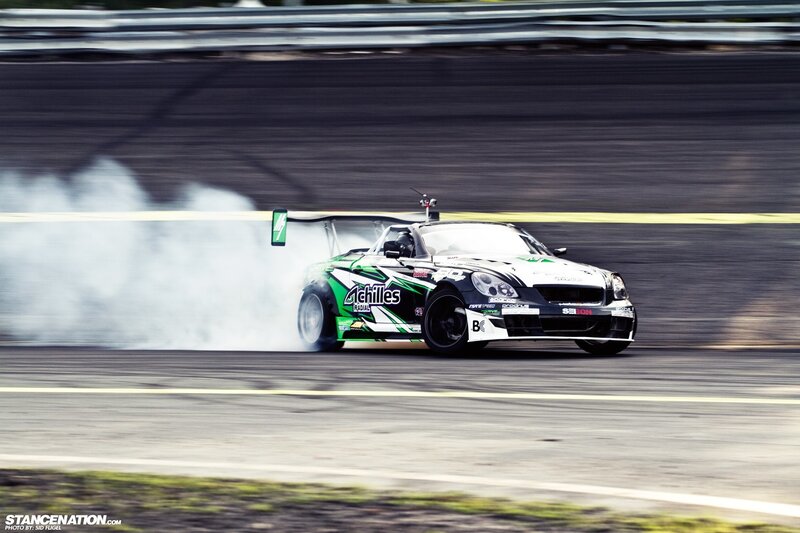 Drifting Race Car — Black, Dynamic, Afternoon, Photograph, Smoke, Racetrack, Tire