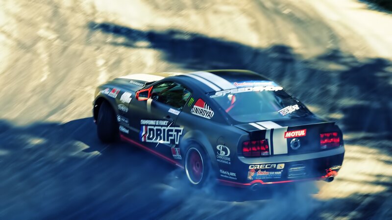 Drifting Race Car — Black, Dynamic, Afternoon, Photograph, Tire Smoke