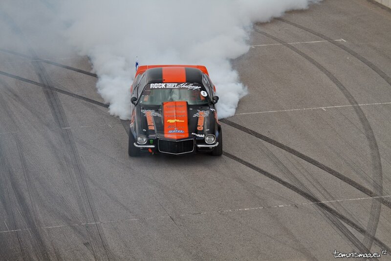 Drifting Race Car — Black, Dynamic, Photograph, Smoke, Tire Marks, Flag