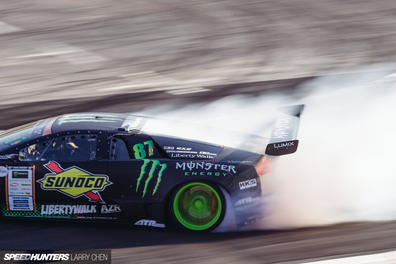 Drifting Race Car — Black, Dynamic, Photograph, Smoke, Tire, Sponsor Logos