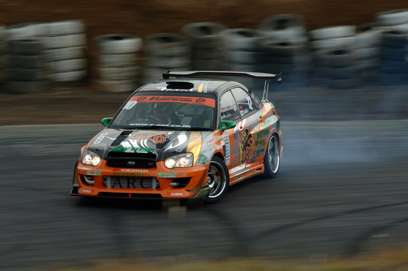 Drifting Race Car — Orange, Dynamic, Photograph