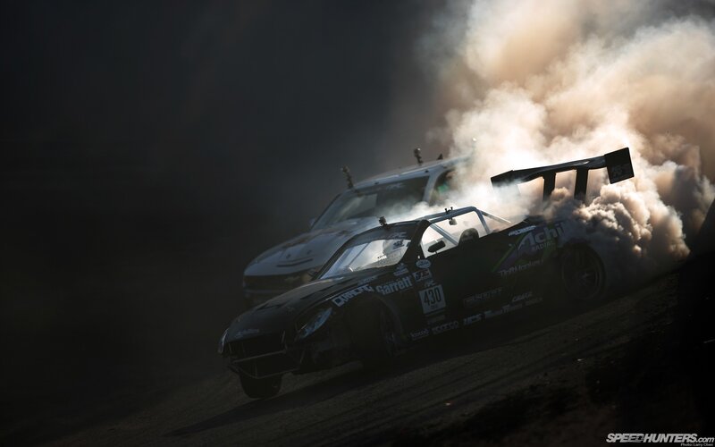 Drifting race cars in smoke