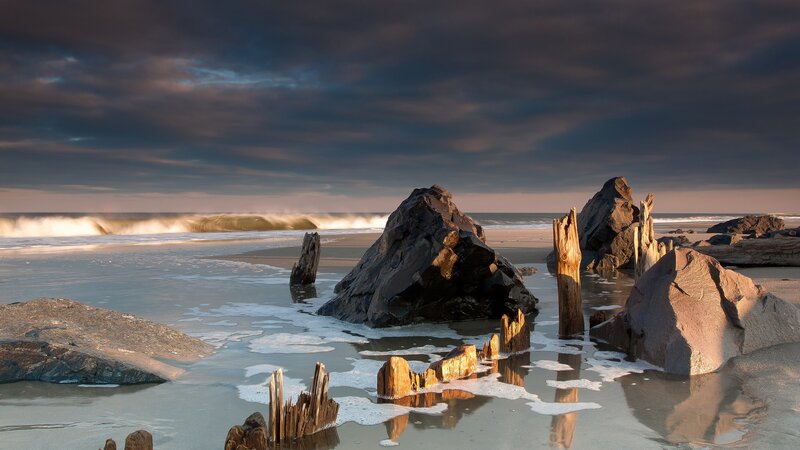Driftwood on Beach — Gray, Dramatic, Sunset, Photograph, Rocks, Ocean