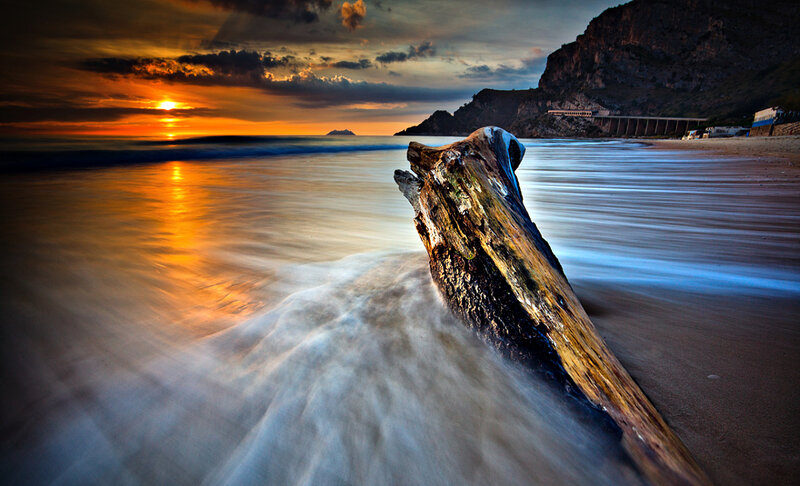 Driftwood on Beach — Orange, Dramatic, Sunset, Photograph, Ocean, Mountain