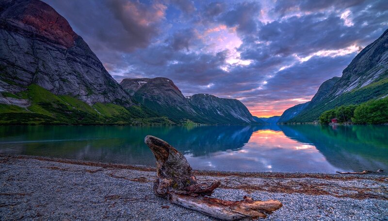 Driftwood on Lake Shore — Blue, Serene, Sunset, Photograph, Mountains, Sky