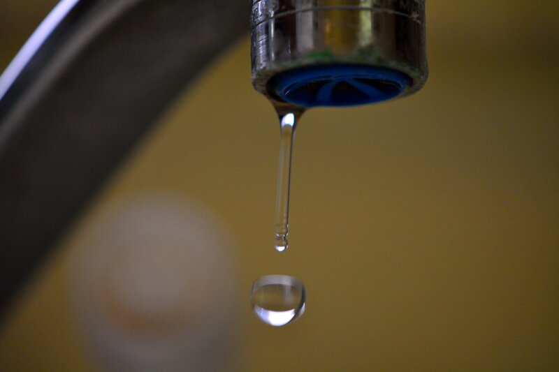Dripping Water from Faucet — Yellow