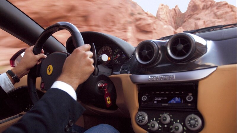 Driver in a Ferrari sports car