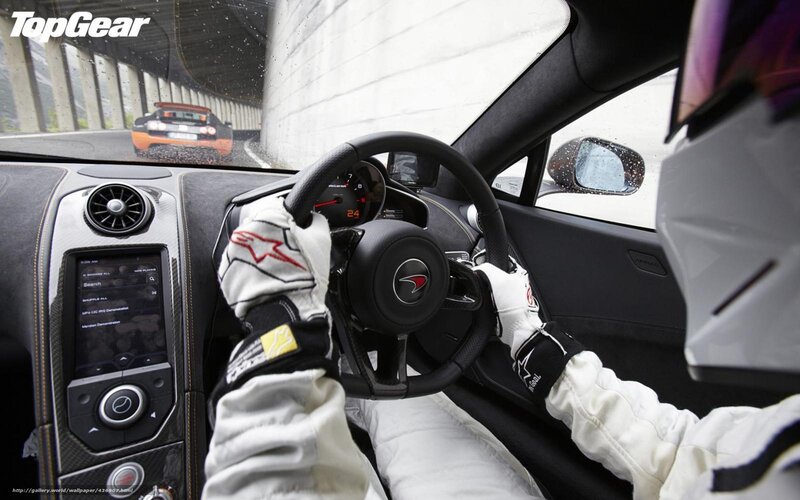 Driver in a McLaren sports car
