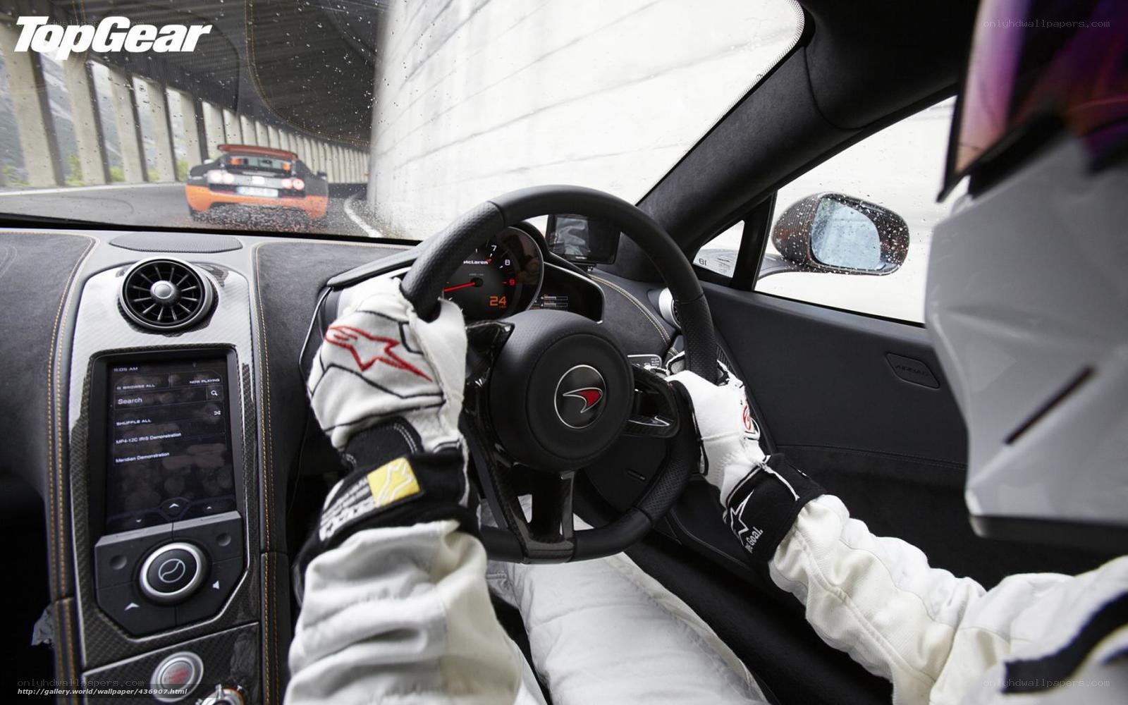 Driver in a McLaren sports car