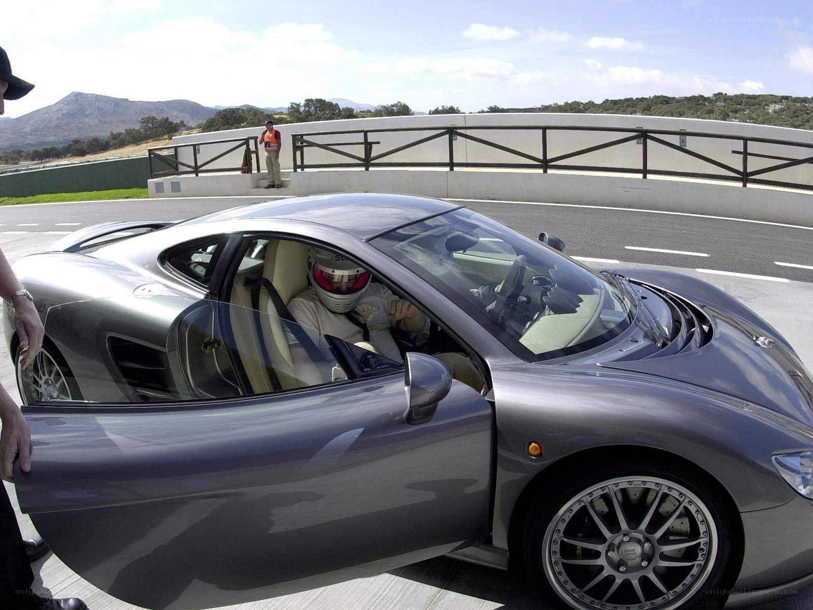 Driver in racing car on track