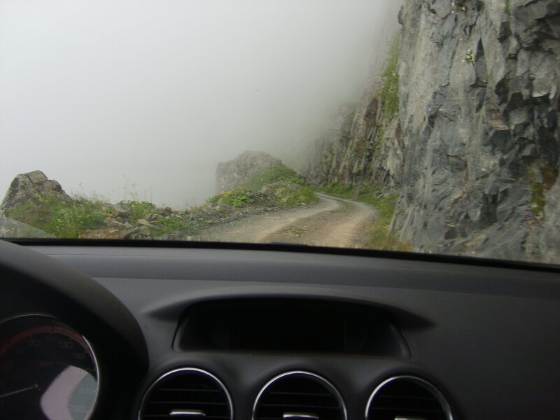 Driving on a foggy mountain road