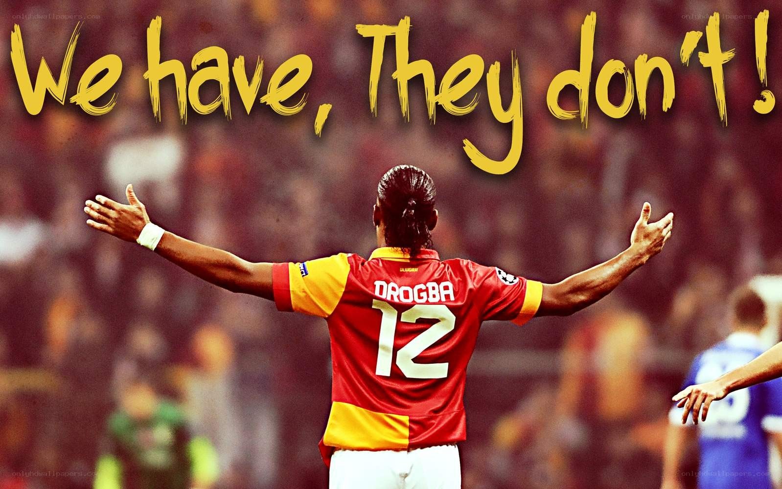 Drogba celebrates with arms wide