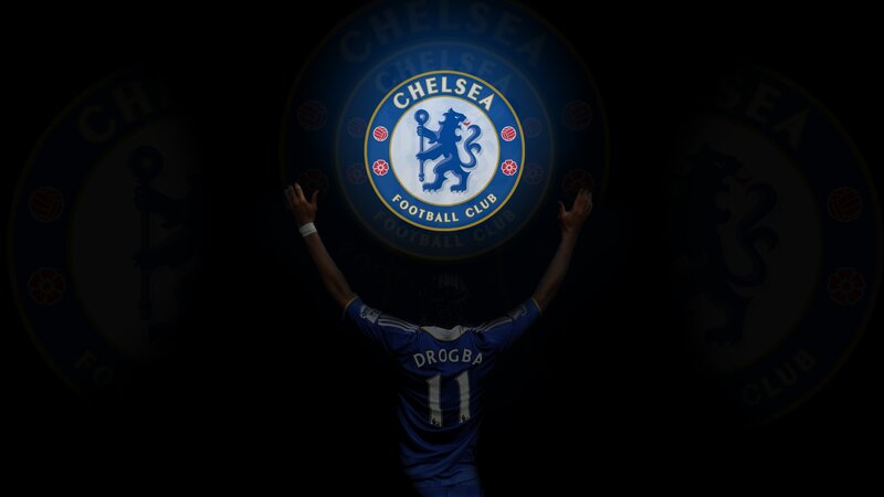 Drogba with Chelsea crest