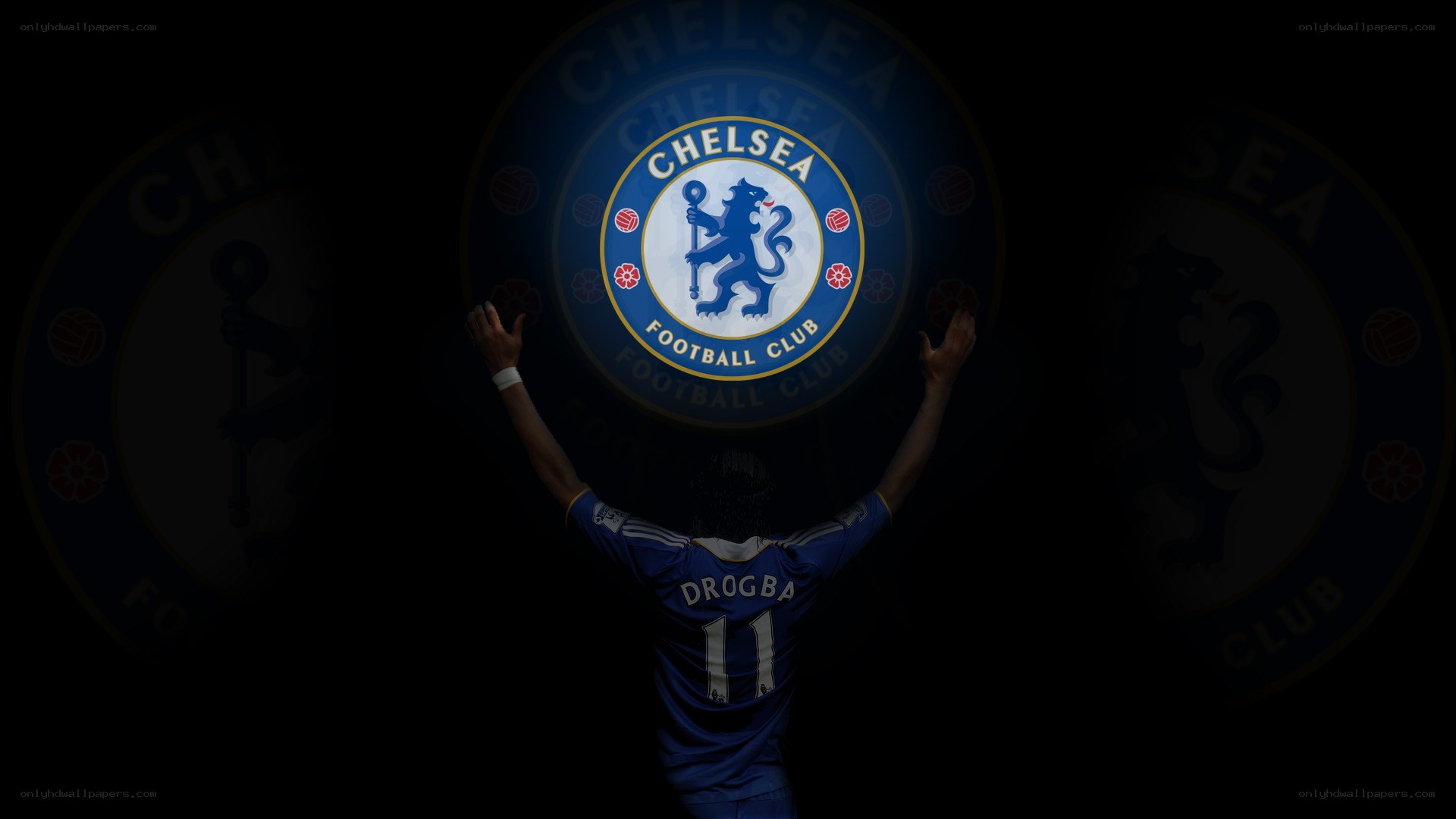 Drogba with Chelsea crest