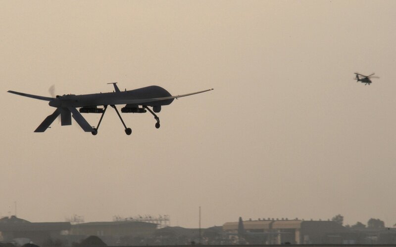 Drone and helicopter in flight