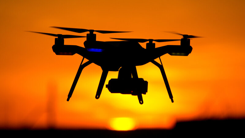 Drone silhouetted at sunset